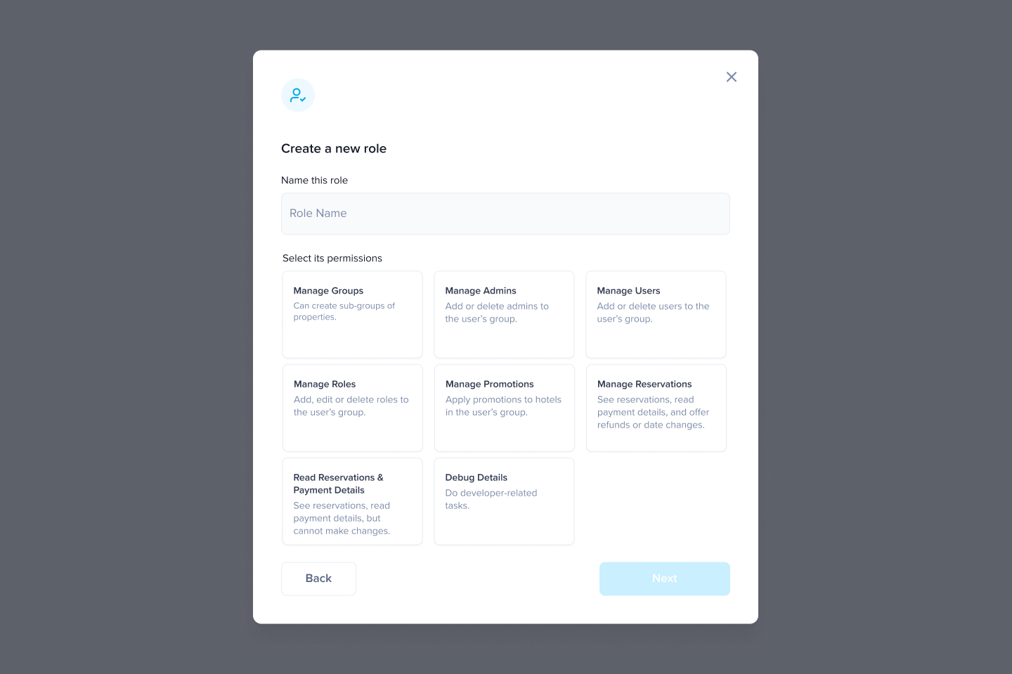 Role wizard step two in empty state, with Role Name field empty, 8 permission cards unchecked (Manage Groups, Manage Admins, Manage Users, Manage Roles, Manage Promotions, Manage Reservations, Read Reservations and Payment Details, Debug Details), and the Next button disabled.